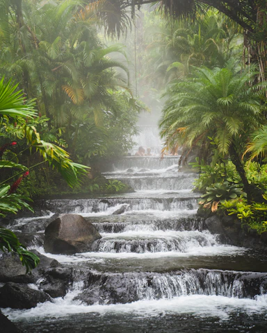 a waterfall in a tropical area