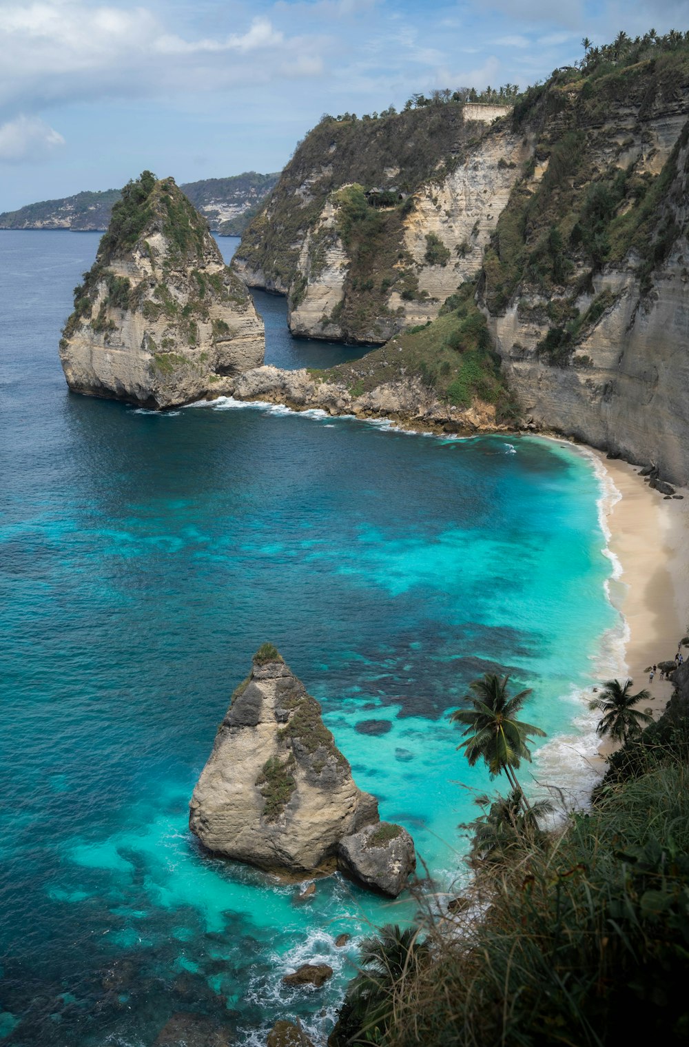 a beach with rocks and a body of water