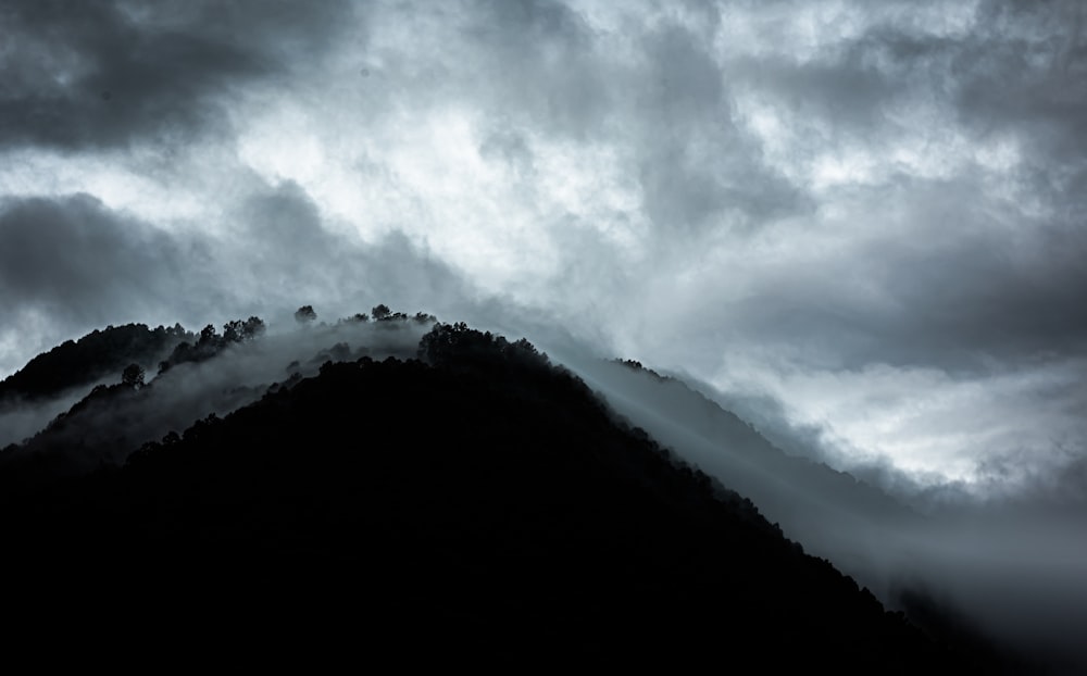 a mountain covered in clouds