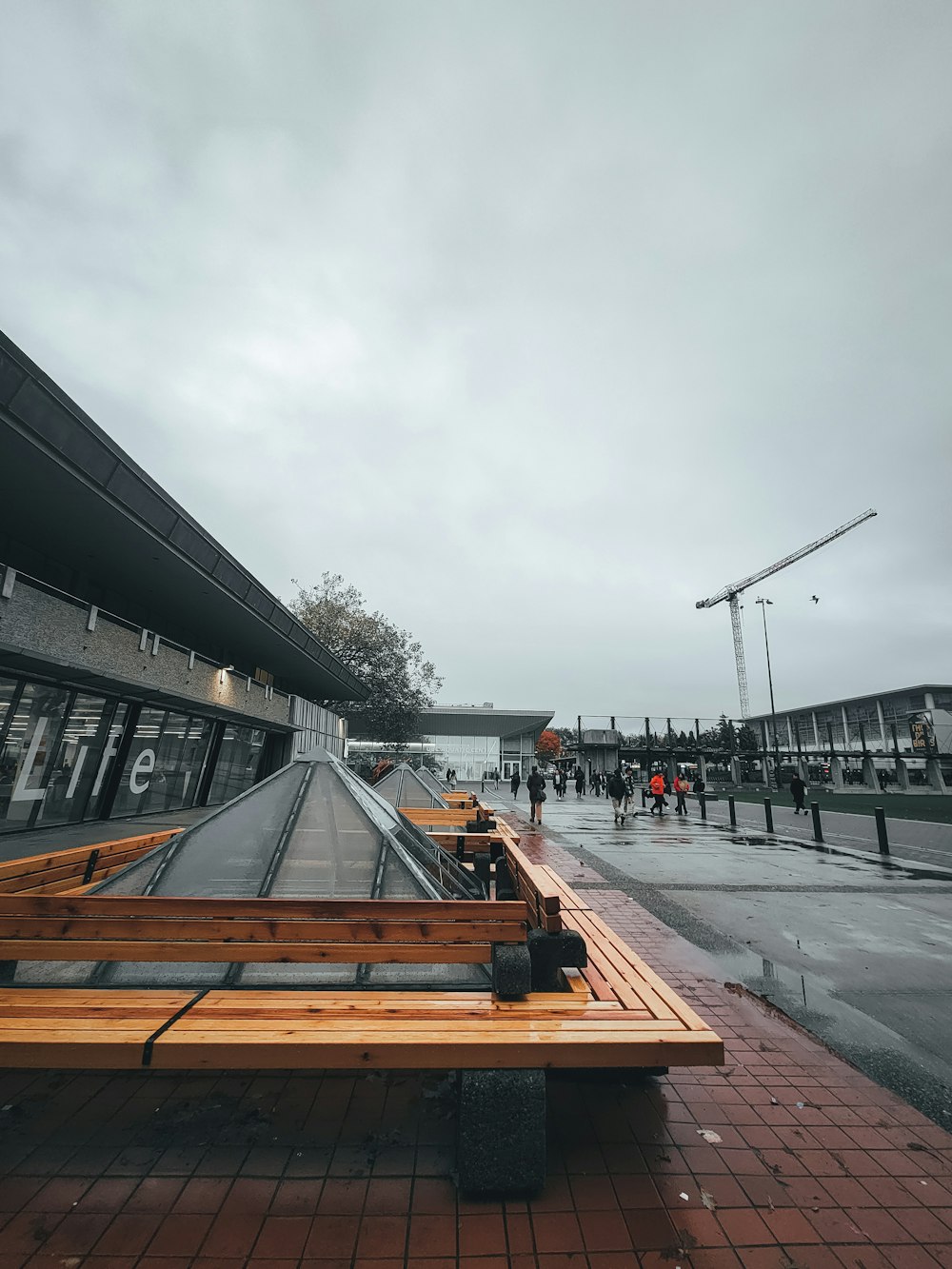 a building with a crane in the background