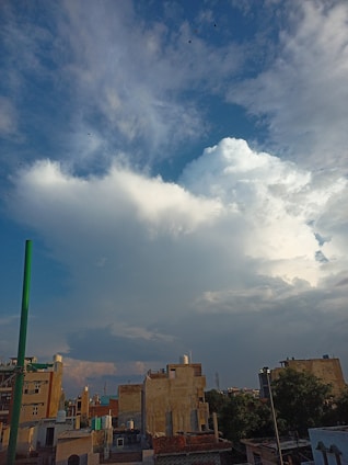A vibrant montage showing a landscape architect reviewing blueprints, a contractor at a construction site, and a custom home builder discussing plans.