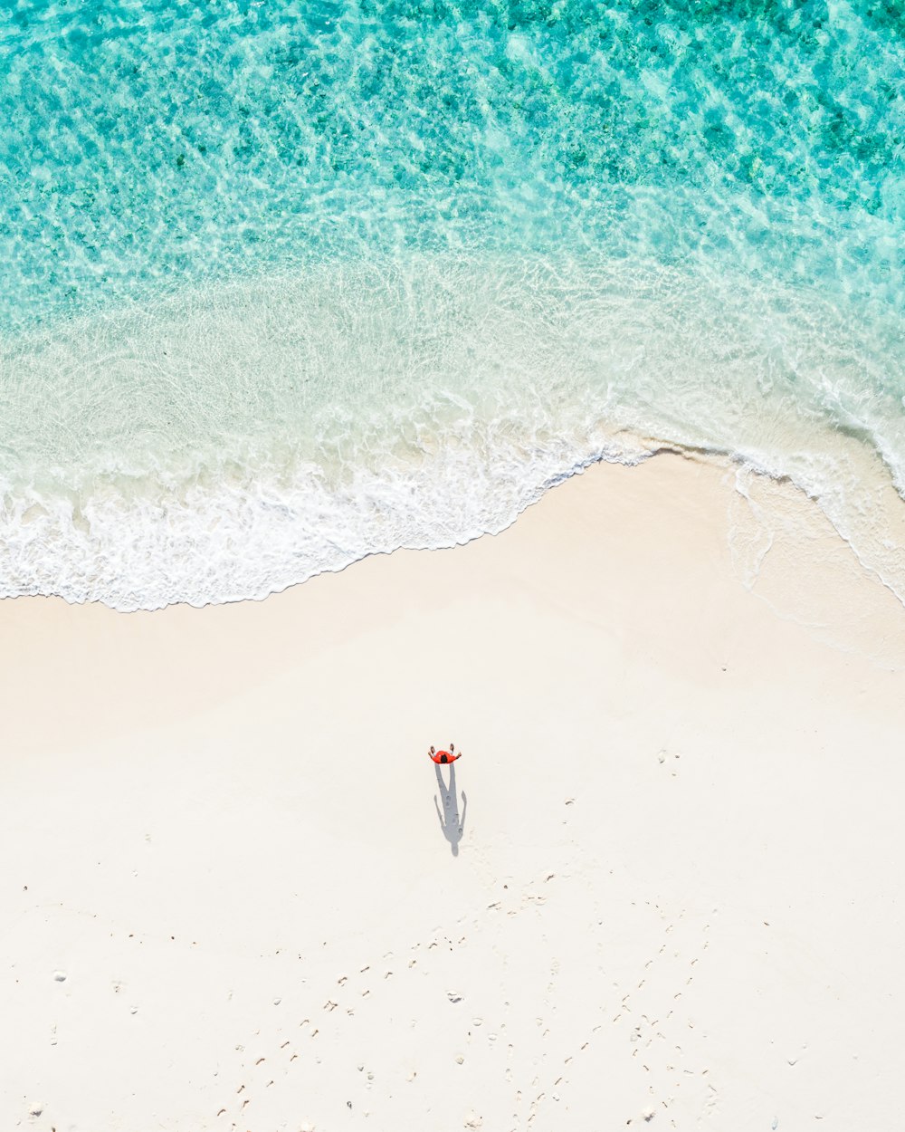 a person walking on a beach