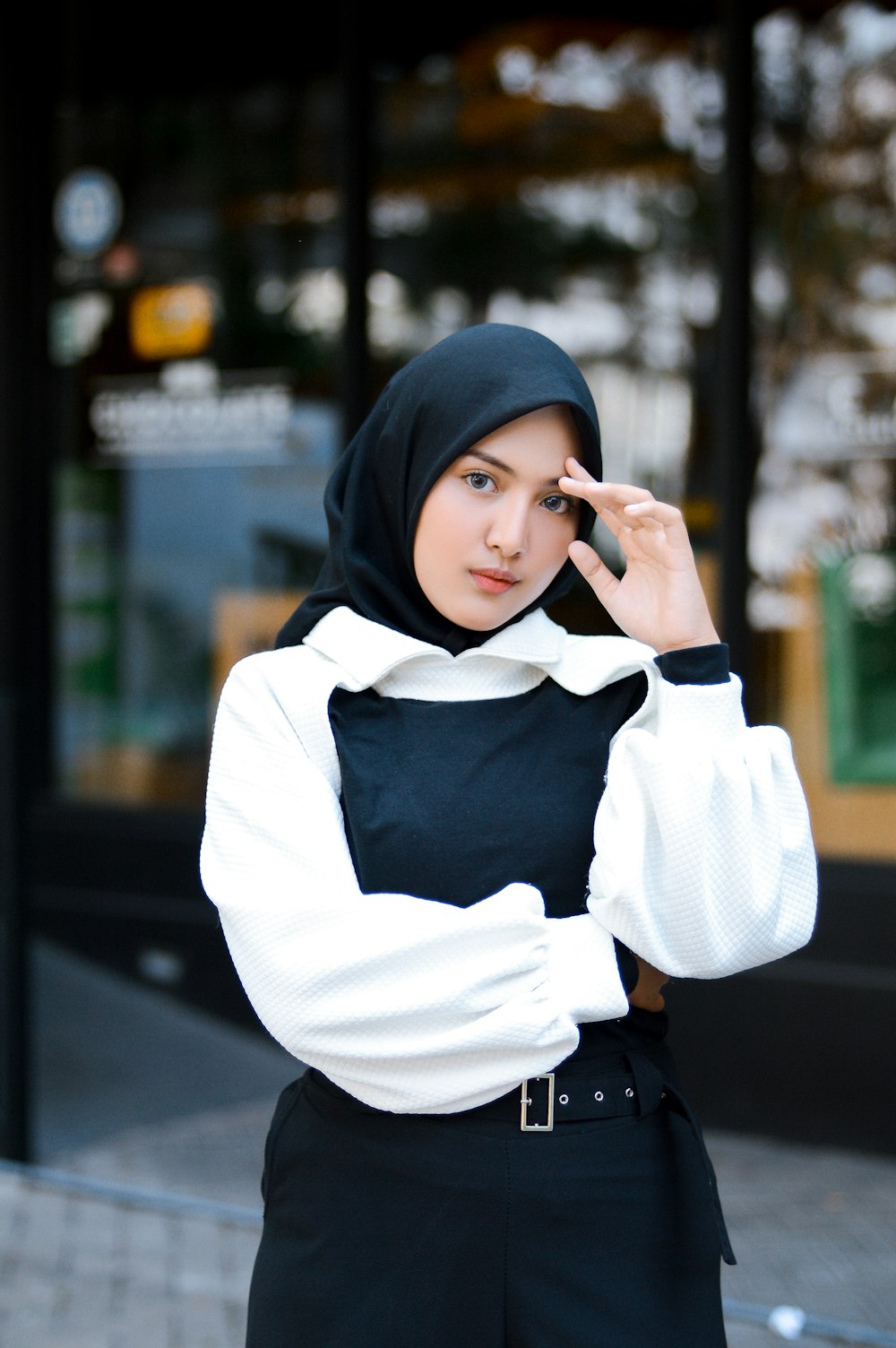 a woman in a black head scarf