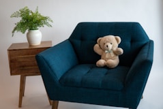 a teddy bear sitting on a chair