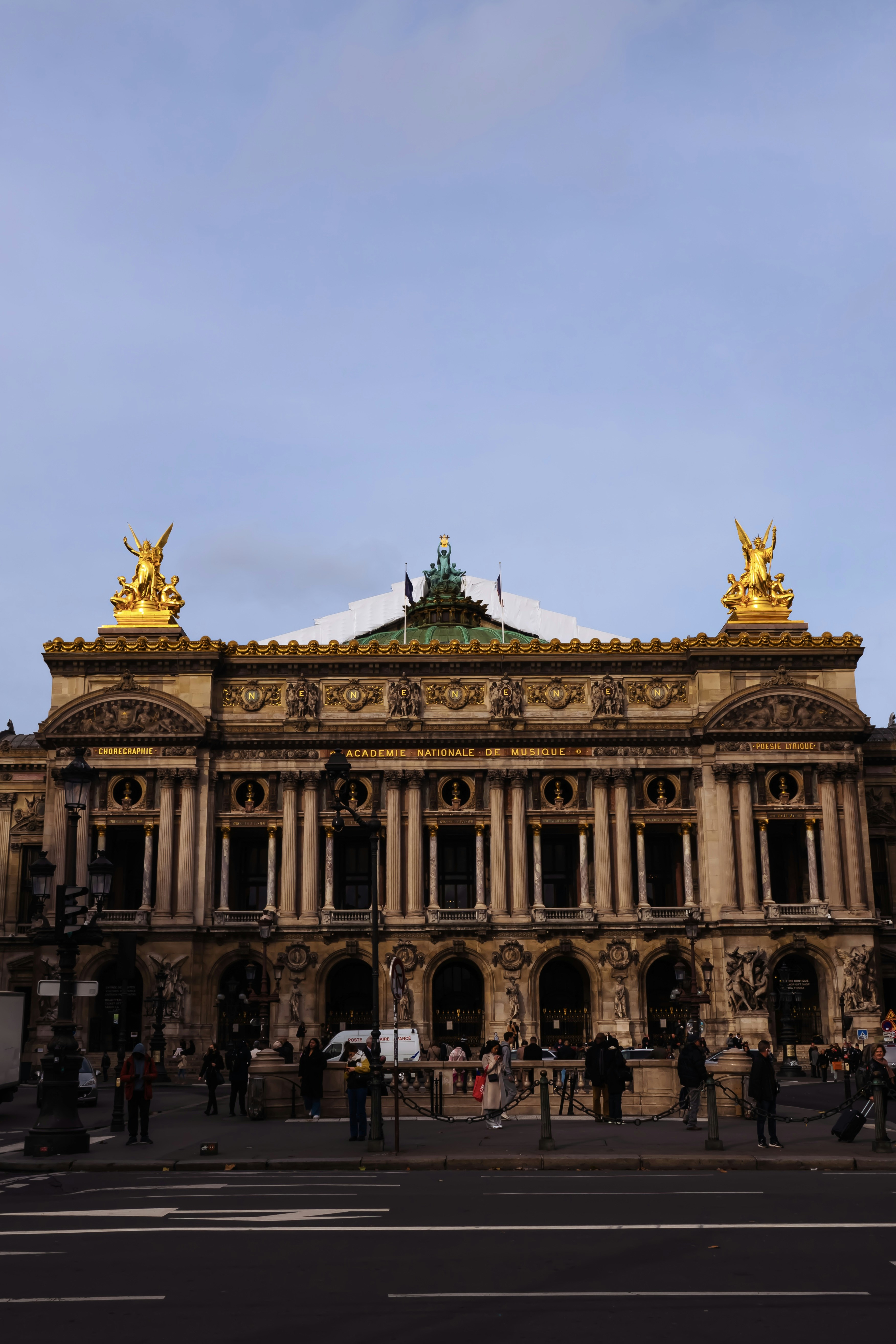 a large building with a statue on top