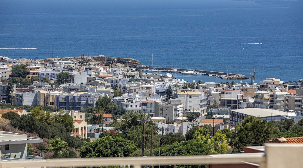 a city with a body of water in the background