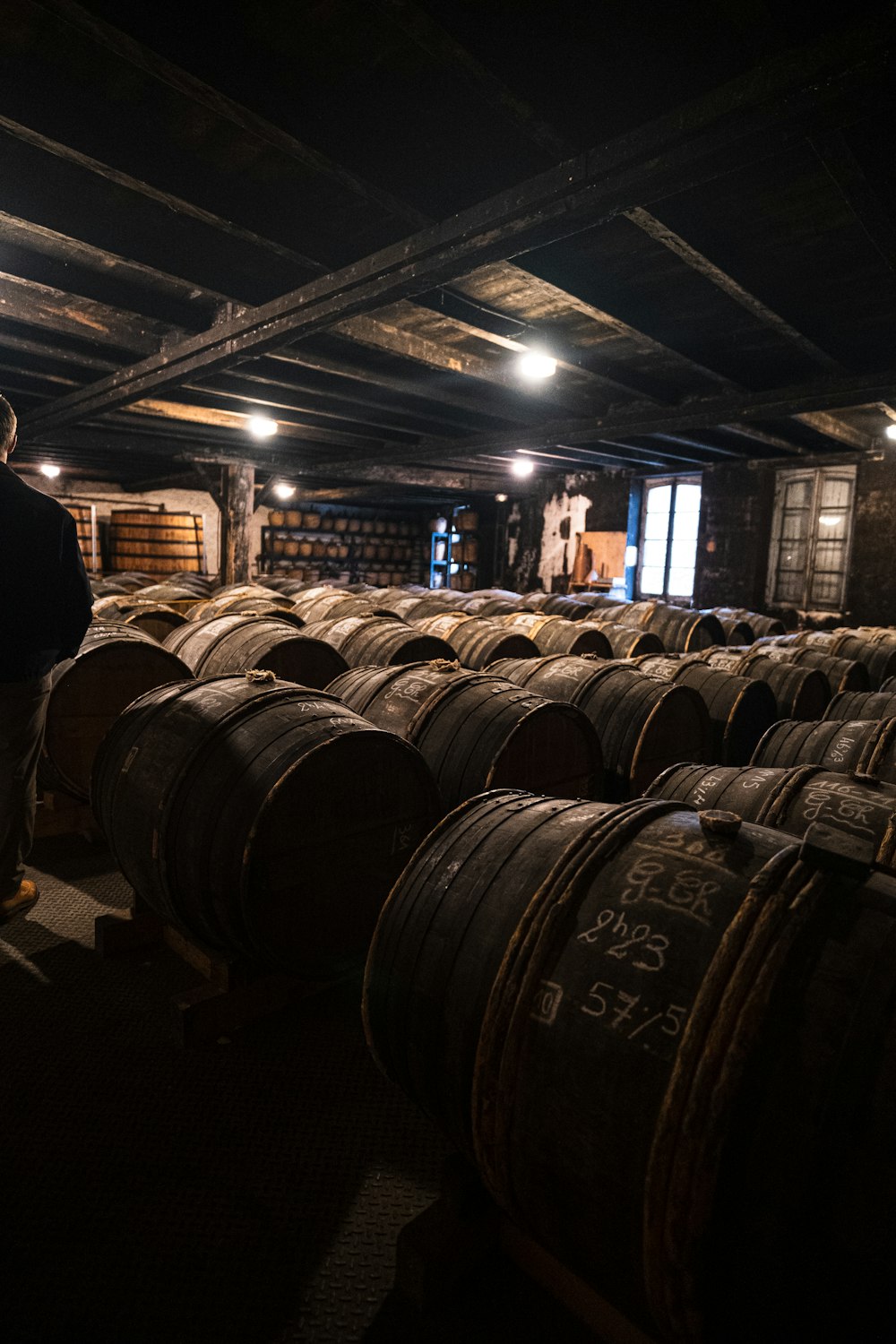 a large room with barrels