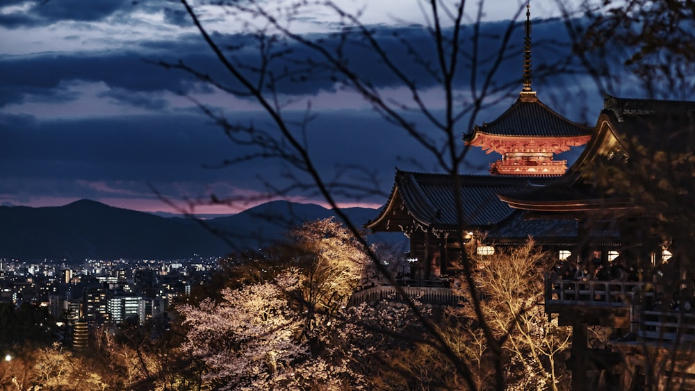 a pagoda with a city in the background