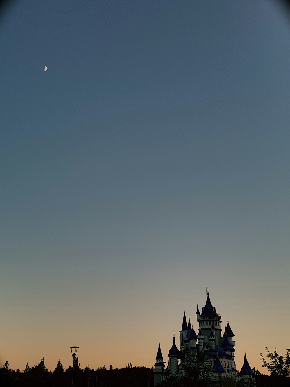 a building with a moon in the sky