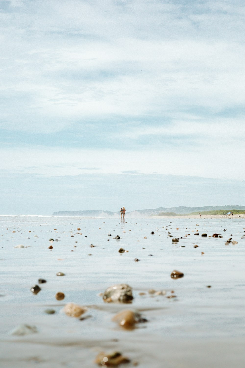 a person walking on a beach