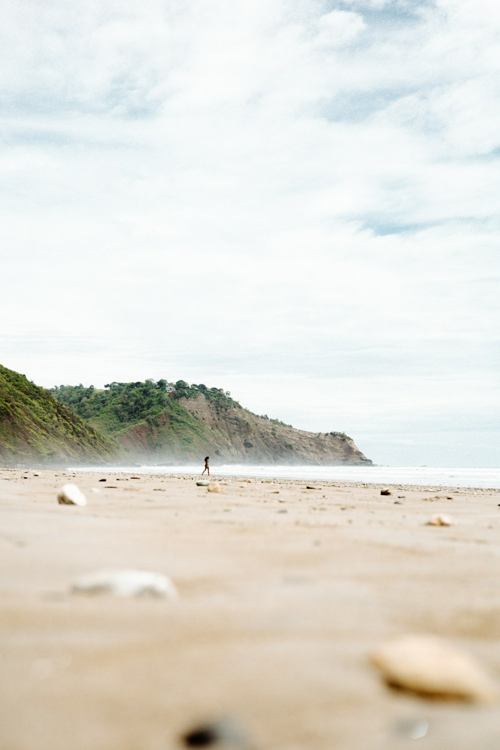 a person walking on a beach