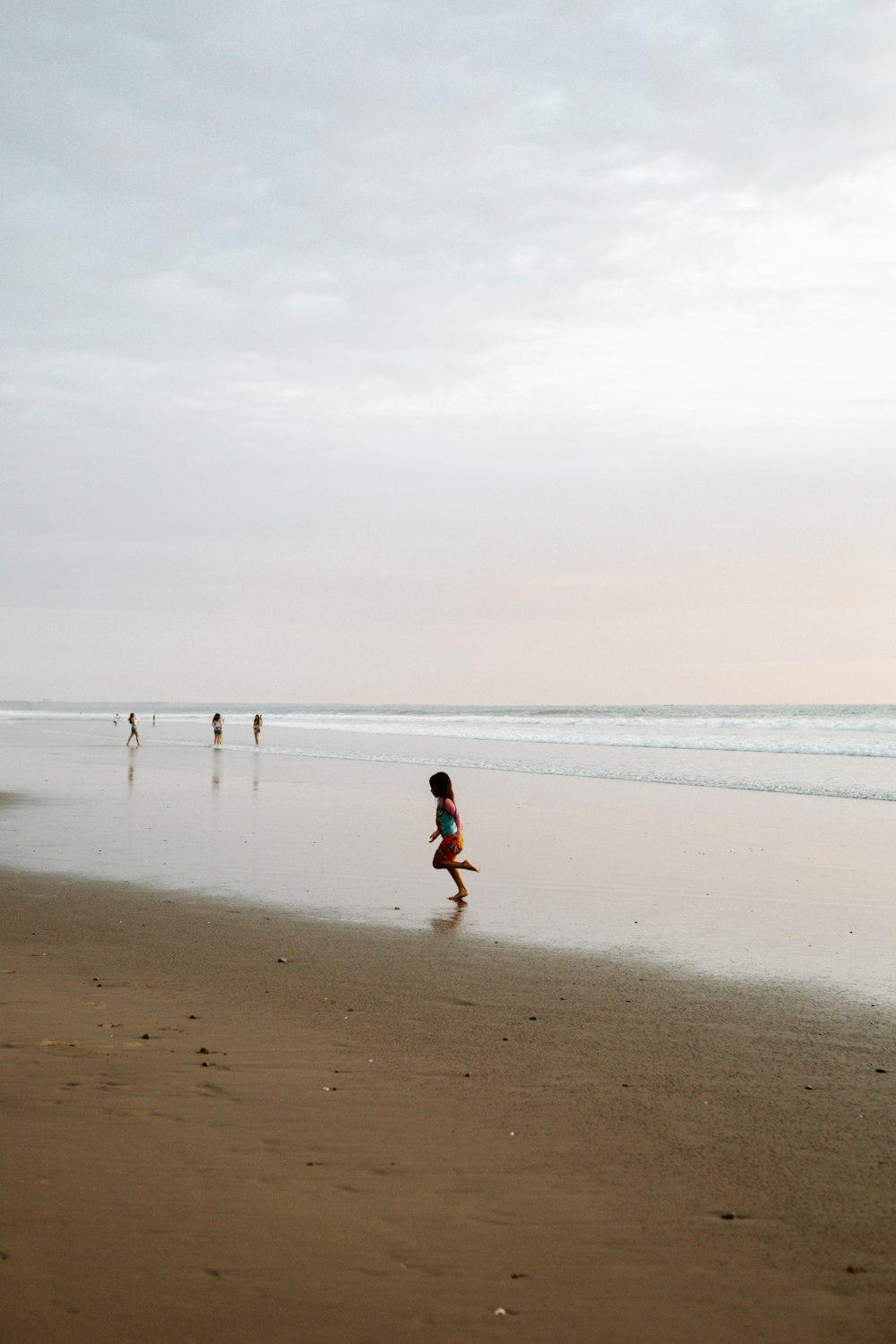 a group of people on a beach