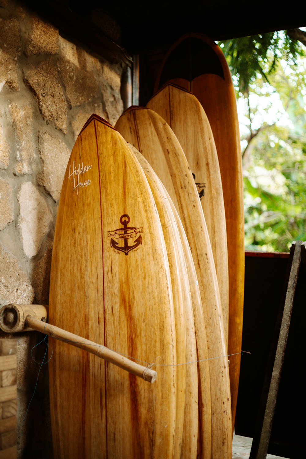 a surfboard leaning against a wall