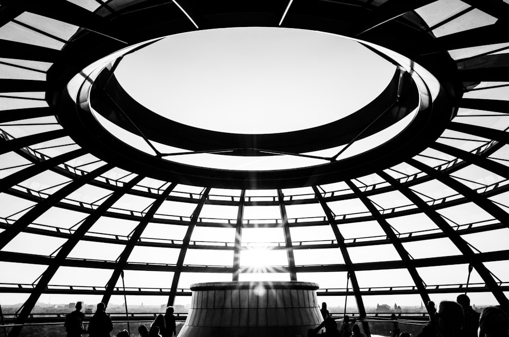 a large glass ceiling with people below