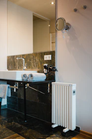 A modern bathroom setting featuring towels arranged with futuristic decor elements.