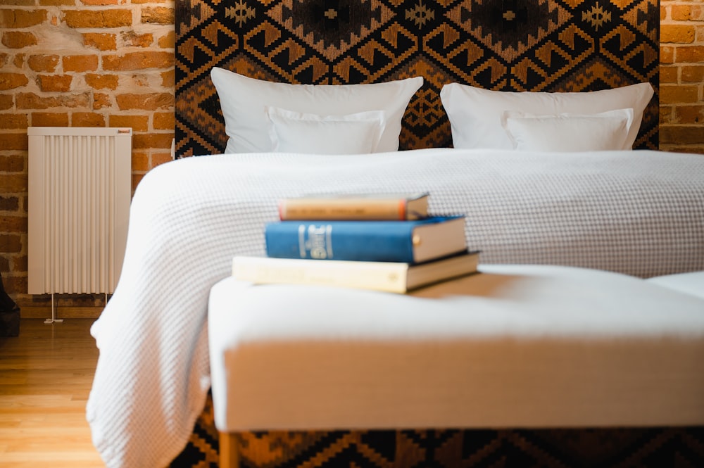 a bed with books on it