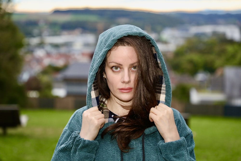 a woman with a hood on her head