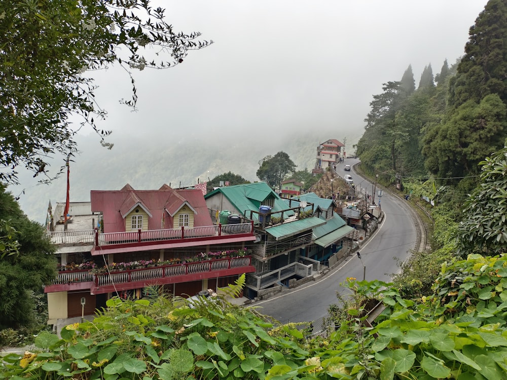 a building with a road and trees around it