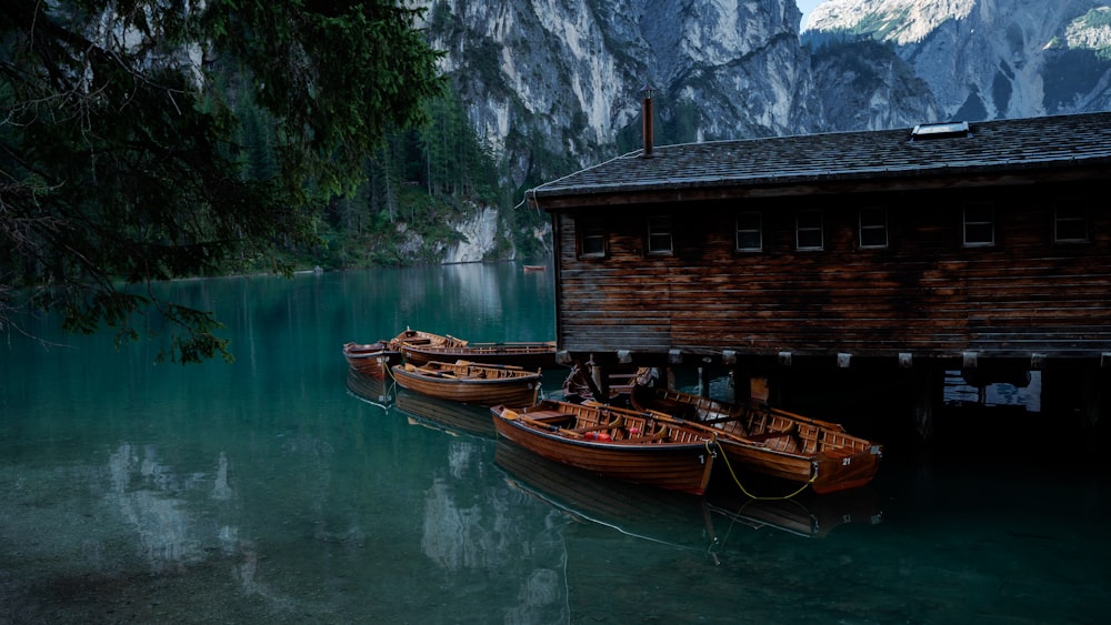 a group of boats sit in a river