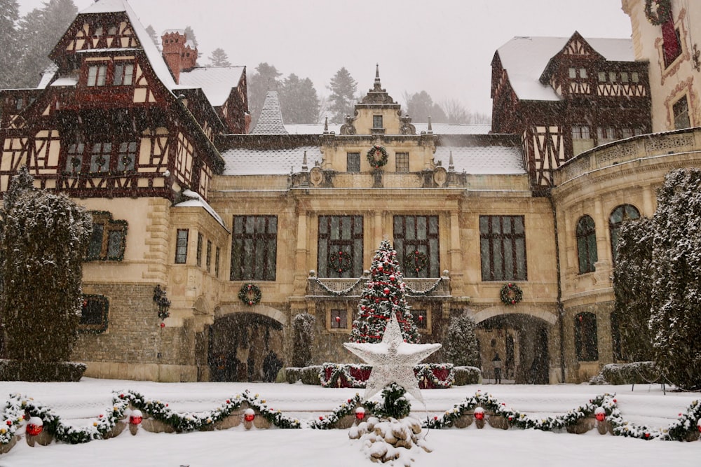 a large building with a large courtyard and snow on the ground