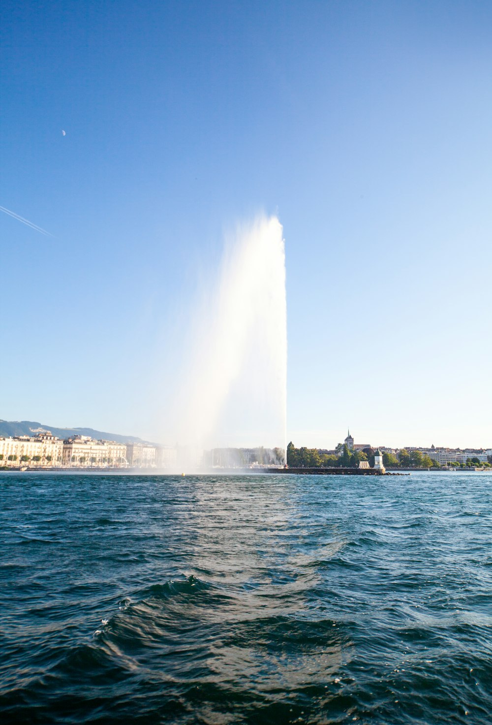 a large fountain in the middle of a body of water