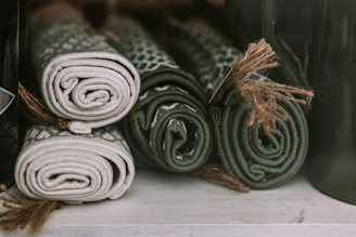 A set of floor mats in coordinating colors placed side by side on a hardwood floor.