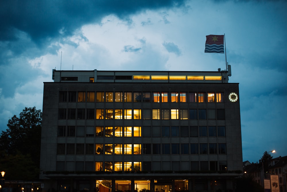 a large building with a flag on top