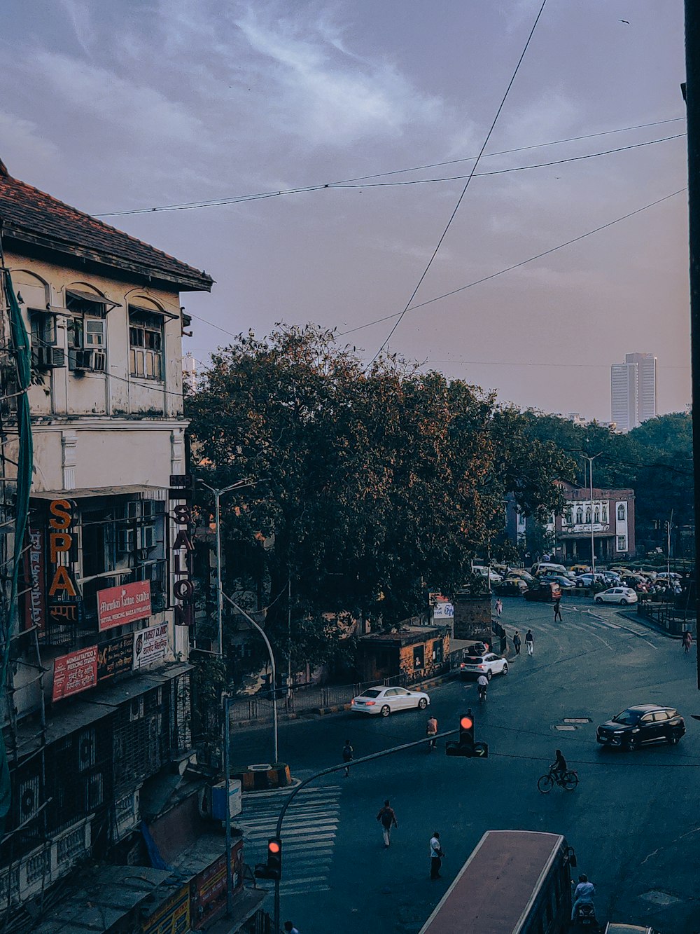 a city street with cars and people