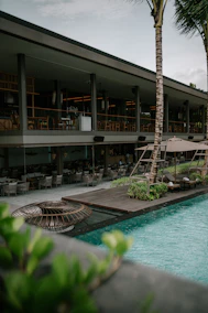 a pool with a building in the background
