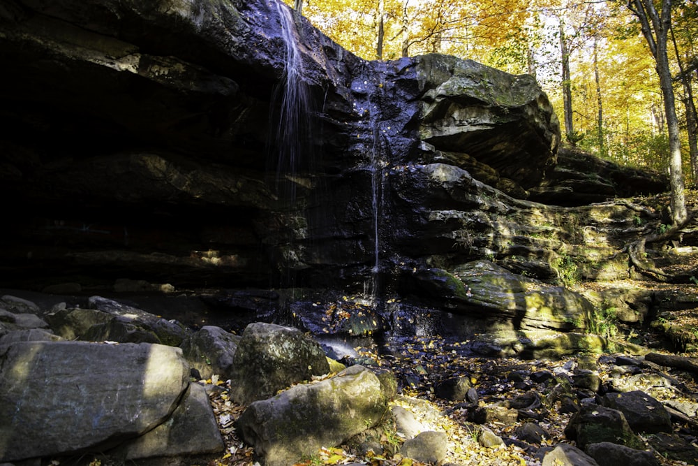 a waterfall over a rocky cliff