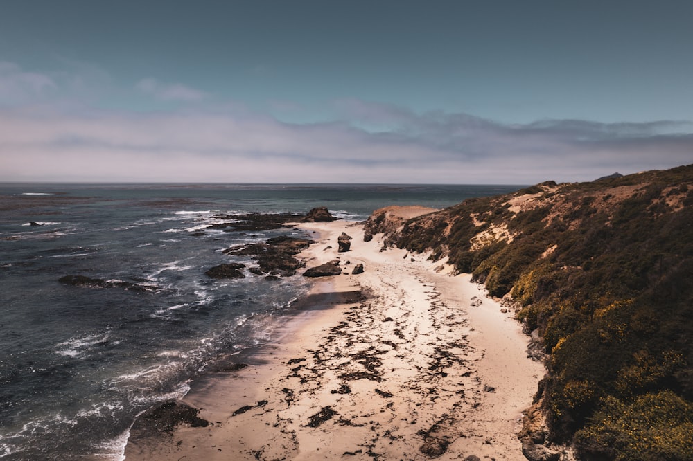 a beach with rocks and water