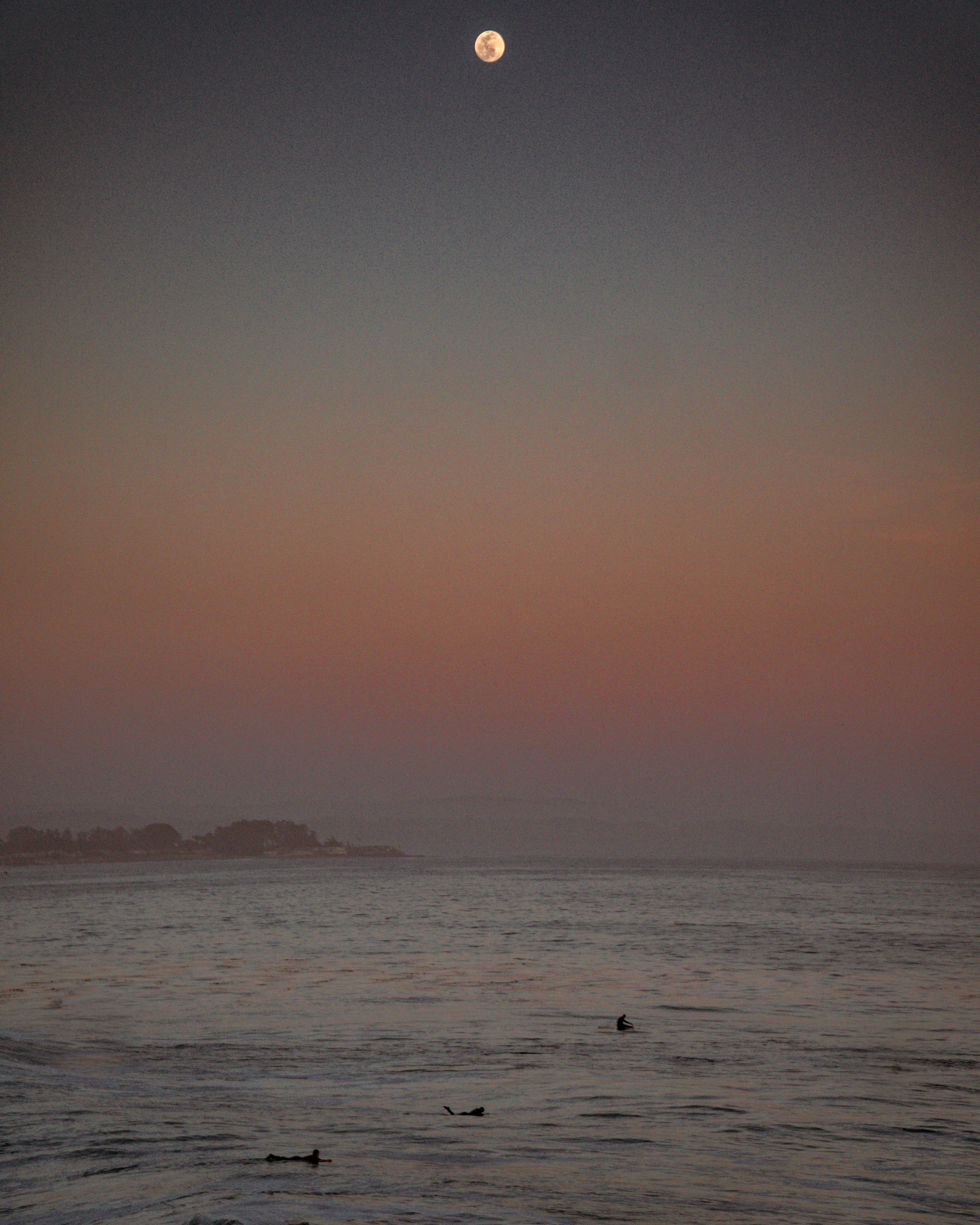 a body of water with a sunset