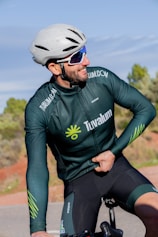 a person wearing a helmet and riding a bicycle