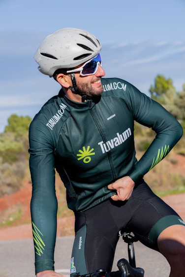 a person wearing a helmet and riding a bicycle