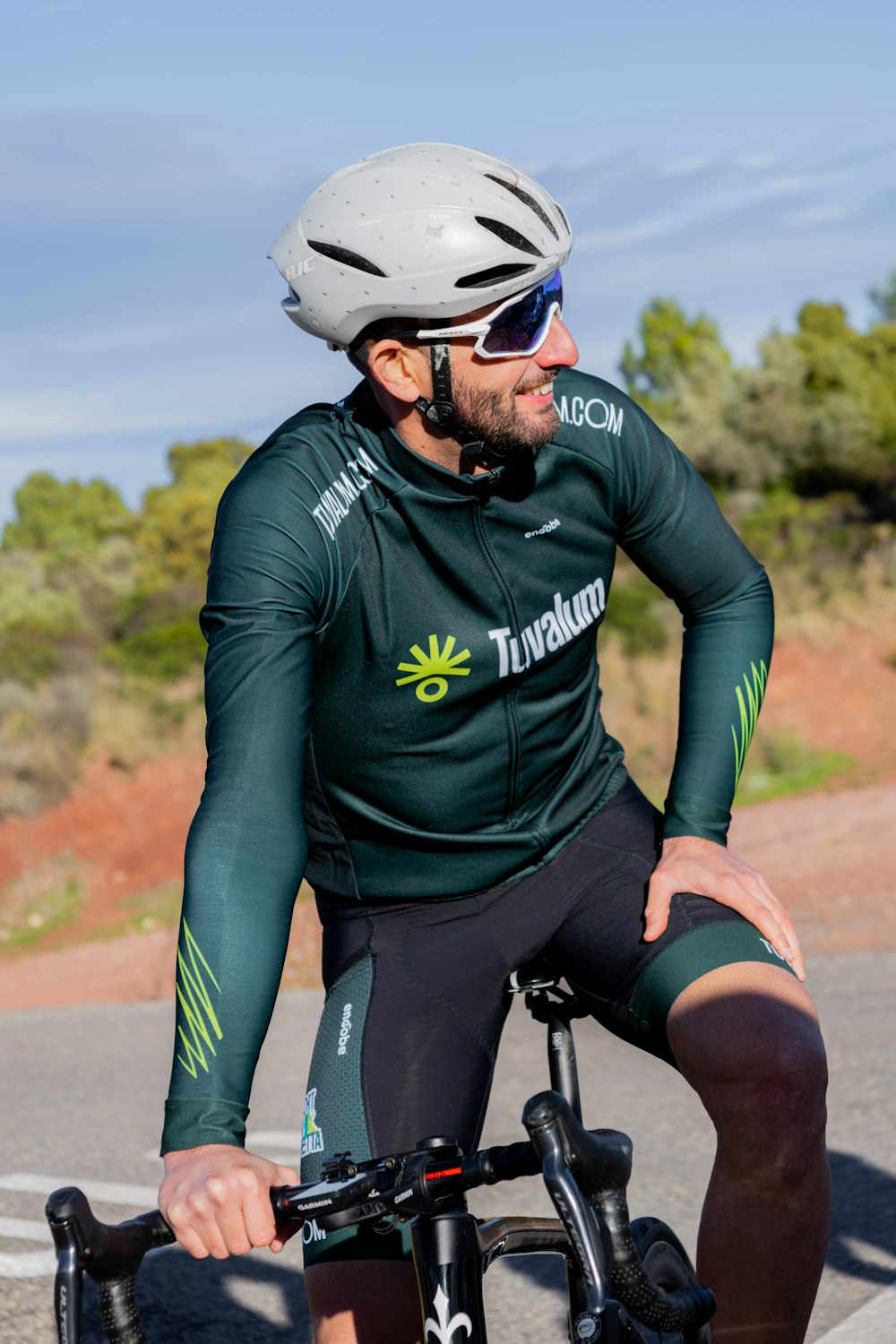 a person wearing a helmet and riding a bicycle