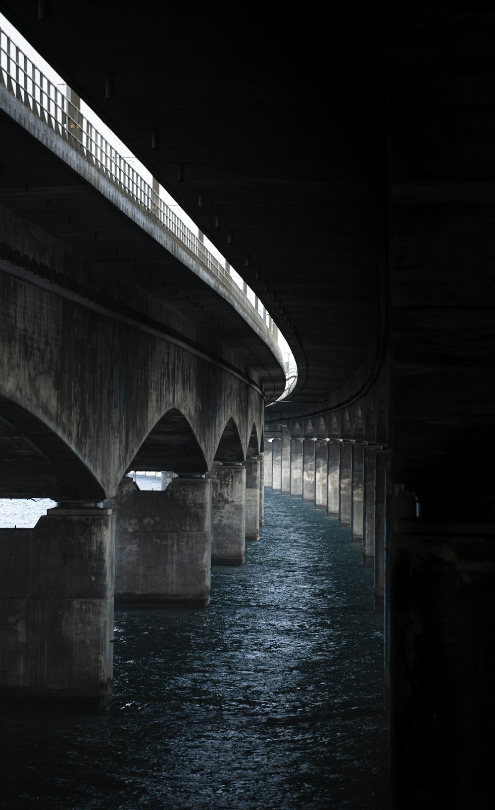 a bridge with a river underneath