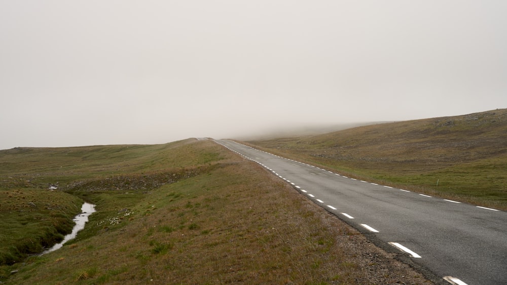 a road with grass on the side