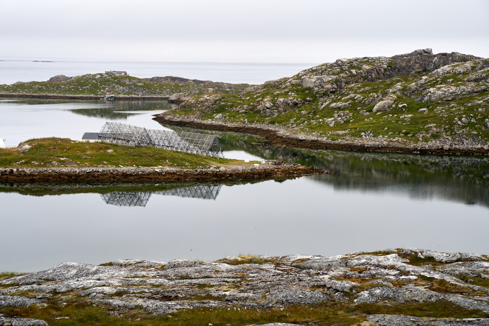 a body of water with land in the back