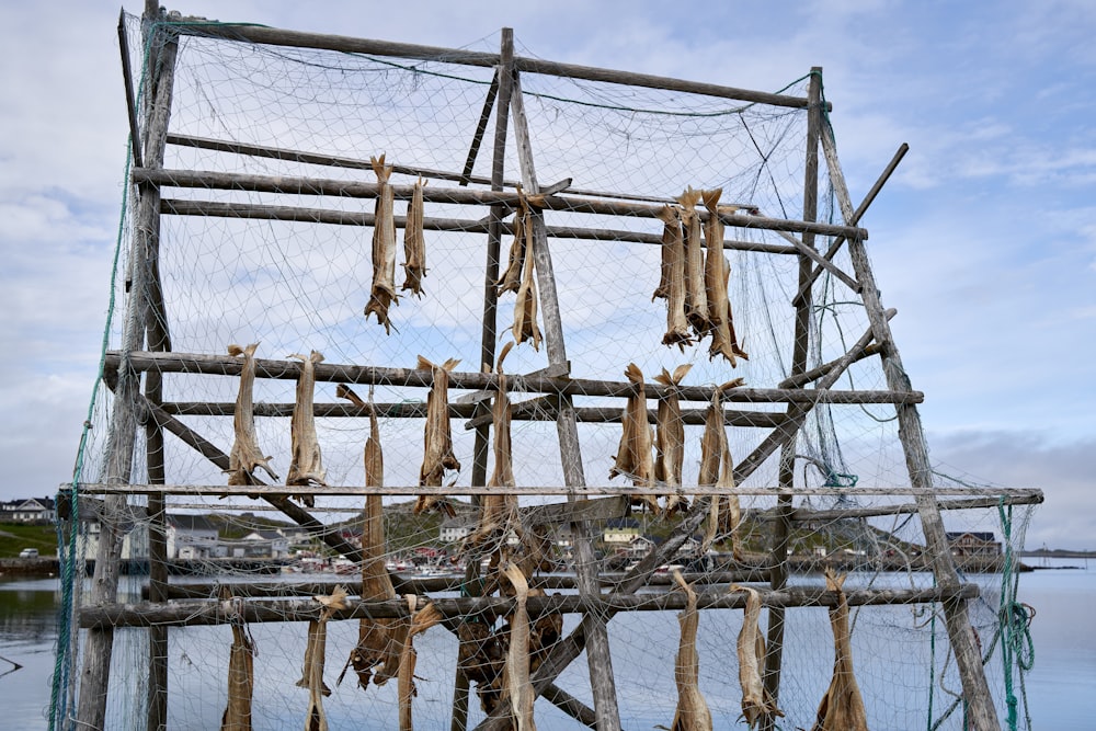 a large wooden structure with many sticks on it