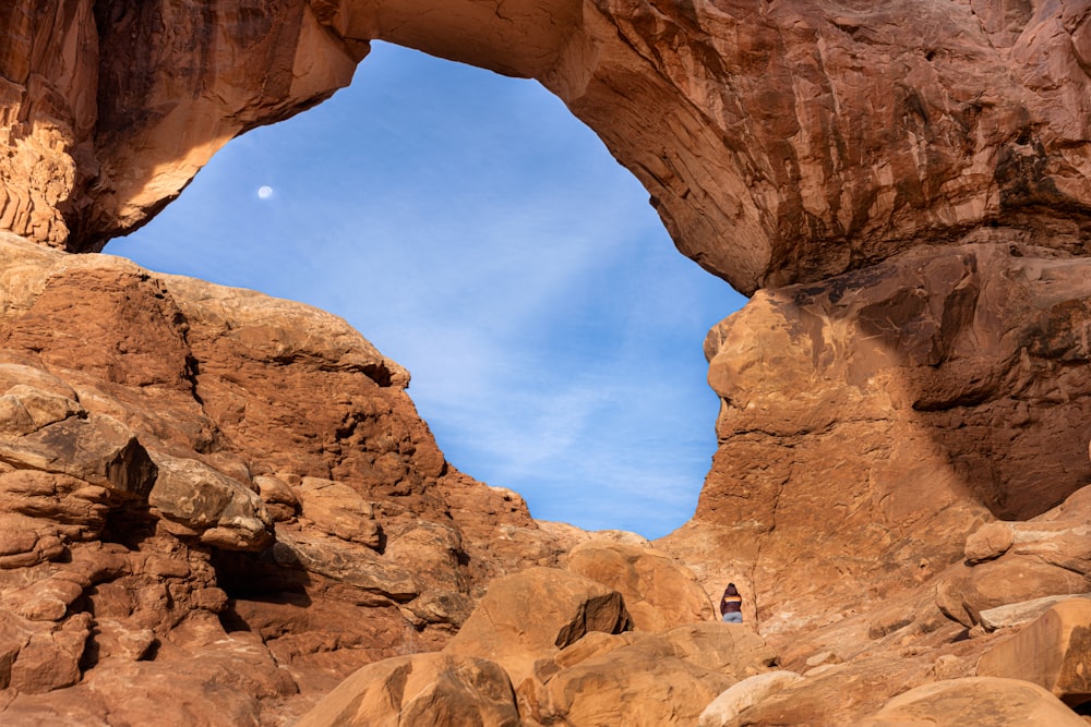 a person walking through a canyon