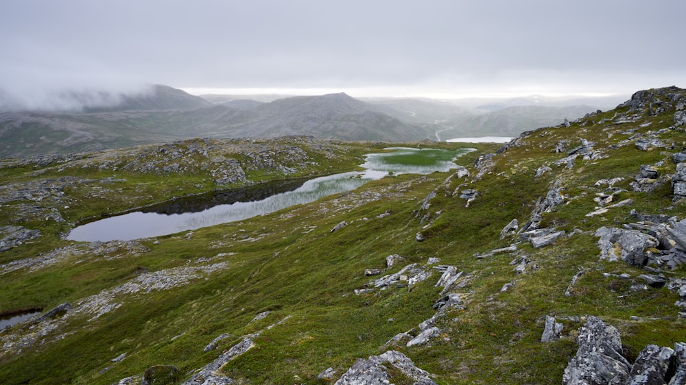 a rocky landscape with a river running through it