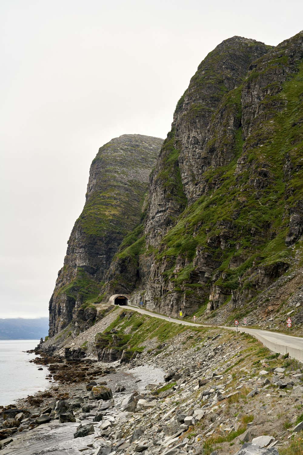 a rocky cliff with a road