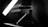 Close-up of a 3D scanner capturing a detailed object in a well-lit studio.