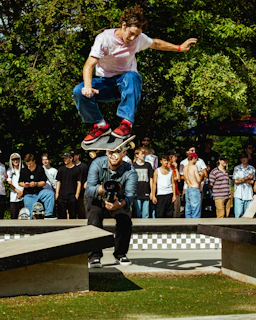 a man jumping in the air with a skateboard