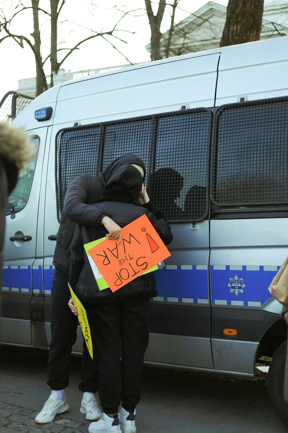 a couple of people holding a sign