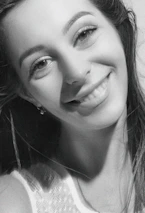 A candid moment of Isabella smiling warmly backstage before a show.