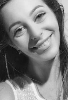 A candid moment of Isabella smiling warmly backstage before a show.