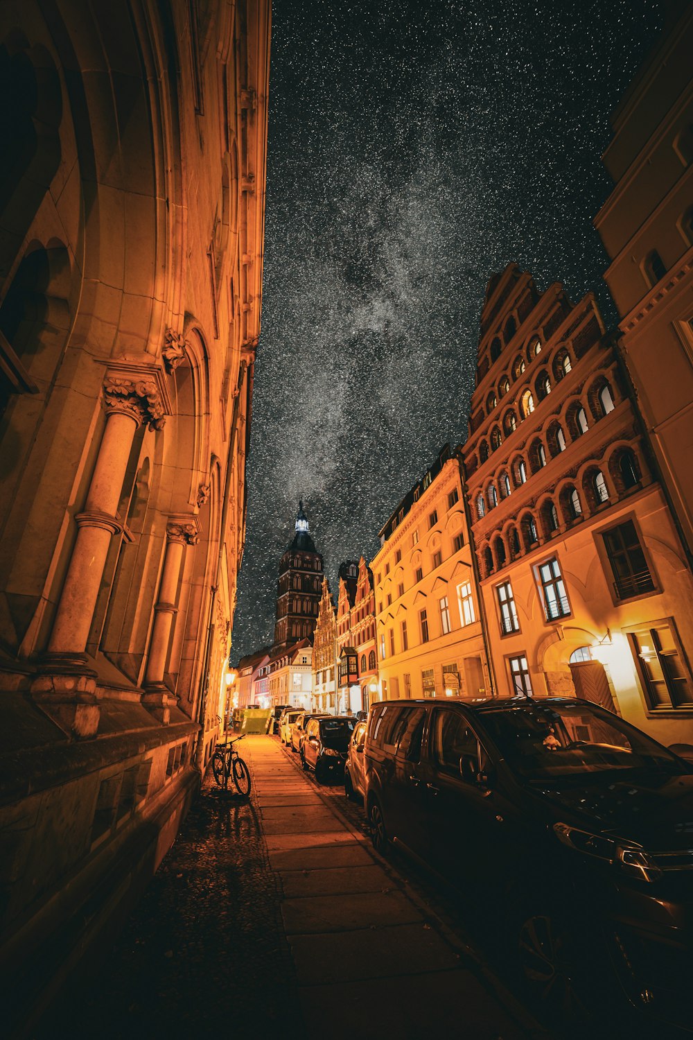 a street with cars and buildings on either side of it