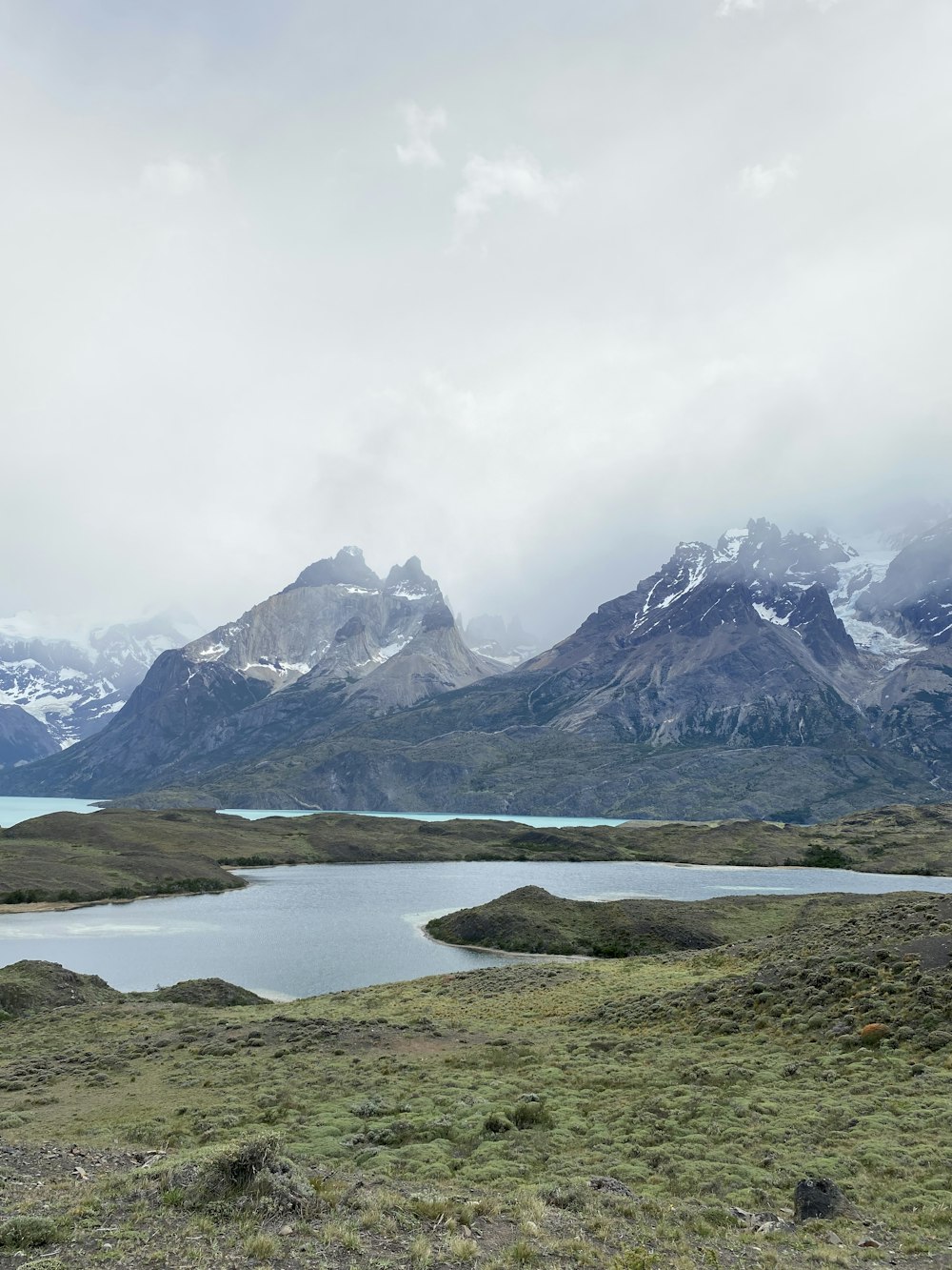 a lake with mountains in the background