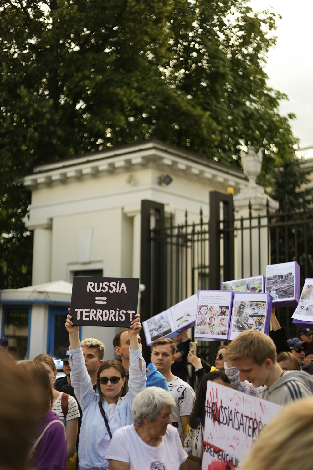 a group of people holding signs